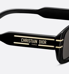 The DiorSignature S12I sunglasses enhance the now iconic House line with a contemporary low, rectangular shape. The thin, lightweight black acetate frame showcases the Christian Dior Paris signature embellished with gold-finish metal lines that extend toward the lenses. Completed by gray lenses, the modern sunglasses will lend a decisively Dior style to any look.. Black Rectangular Sunglasses, Dior Style, Denim Swimsuit, Christian Dior Paris, Dior Star, Dior Paris, Icon Shoes, Gray Lenses, Modern Sunglasses