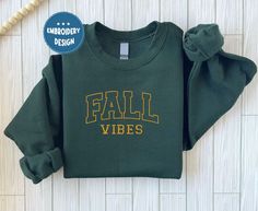 Fall Vibes Sweatshirt, Boo Embroidered Halloween Sweatshirt | Spooky Season Fun Fall Crewneck Sweater | Autumn Pullover  ABOUT US: --------------- ✔  Looking for a personalized, comfortable, and soft sweatshirt/hoodie? Then you can express yourself with our products! From color and size to unique designs, we have everything you need to create a sweatshirt/hoodie that perfectly represents you. If you have any questions, don't hesitate to contact us and we'll get back to you as soon as possible. H Fall College T-shirt With Embroidered Graphics, Varsity T-shirt With Embroidered Graphics For Fall, Embroidered Fall College T-shirt, Embroidered Fall College Top, Fall College Top With Embroidered Graphics, Embroidered Graphics T-shirt For College In Fall, Embroidered Graphic Tops For College In Fall, Embroidered Tops For College In Fall, Fall School Spirit Tops With Embroidered Text