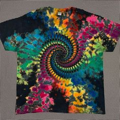 a colorful t - shirt with an abstract design on it