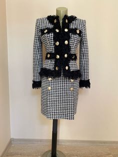 This is a very stylish and elegant womens suit . The jacket have linning. Length of the jacket 57 cm/ 22 inches. Length of the skirt 46 cm/18 inchesThe suit is jacket and skirt. All my garments are custom made, so if you provide your measurements it can be made according to them. SIZE CHARTSIZE S - US 6, UK 8, EU 36bust: bust around 34.5”/90cmWaist: waist around 27.5”/70cmHips: hips around 34.5”/90cmSIZE M - US 8, UK 10, EU 38bust: bust around 37.5”/95cmWaist: waist around 29.5”/75cmHips: hips a Double-breasted Skirt Suit For Office In Fall, Winter Formal Single-breasted Skirt Suit, Elegant Suits With Gold Buttons, Tailored Fall Skirt Suit With Buttons, Office Sets With Buttons For Fall, Fitted Sets With Button Closure For Fall, Formal Long Sleeve Tweed Skirt Suit, Long Sleeve Tweed Skirt Suit For Formal Occasions, Winter Office Skirt Suit, Single Breasted