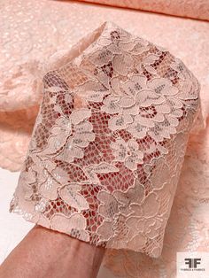 a woman's hand is shown with lace on it