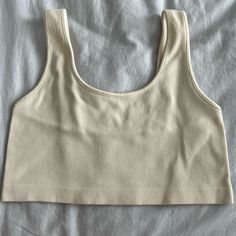 Size Xs/S Off White/Cream Color. Ribbed Material. Super Stretchy Cropped Bra Top Never Worn - Like New Condition! Smoke And Pet Free Home Casual Cropped Beige Tank Top, Casual Beige Cropped Tank Top, Casual Cream Tank Top For Everyday, Beige Sleeveless Crop Top For Everyday, Sleeveless Beige Crop Top For Everyday, Ribbed Cropped Tank Top In Beige, Cream Casual Tank Top, Casual Cream Tank Top, Crop Bra