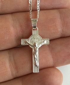 "925 STERLING SILVER SAINT BENEDICT CROSS NECKLACE . 20\" LONG GUCCI CHAIN. FOR GOOD LUCK ,PROSPERITY AND PROTECTION. PENDANT SIZE: 28 mm X 15 mm CADENA DE 925 PLATA ESTERLINA SAN BENITO CRUZ. CADENA 20\" LARGO GUCCI. PARA BUENA SUERTE ,PROSPERIDAD Y PROTECCIÓN... TAMAÑO DEL DIJE : 28 mm X 15 mm" Sterling Silver Cross Pendant Necklace With Charms, Sterling Silver Necklaces With Cross Pendant Charms, Sterling Silver Crucifix Necklace With Silver Chain, Silver Cross Jewelry With Charms, Silver Crucifix Necklace With Charms, Sterling Silver Crucifix Jewelry As Gift, Personalized Silver Crucifix Jewelry, Nickel-free Sterling Silver Crucifix Necklace, Silver Cross Necklace With Charms