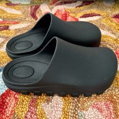 Style No. 78480605; Color Code: 024 Perfect For Post-Workout, These Easy Slip-Ons Feature A Sleek Pvc Upper And Lugged Sole For A Comfy, Pre-And-Post-Workout Pair. Features: Slip-On Style, Backless Design, Clog Construction, Pvc Uppers, Round Toe, Lugged Sole Why We <3 It: These Shoes Are The Perfect Pair To Slip On After The Gym. Brand New-Never Worn! Size Small (5/6) Black Slip-on Platform Slippers, Platform Synthetic Clogs For Streetwear, Synthetic Platform Clogs For Streetwear, Black Slide Mules With Textured Footbed, Black Slip-on Clogs With Textured Footbed, Black Textured Footbed Slip-on Clogs, Streetwear Synthetic Platform Clogs, Black Slip-on Platform Slippers Casual, Black Casual Slip-on Platform Slippers