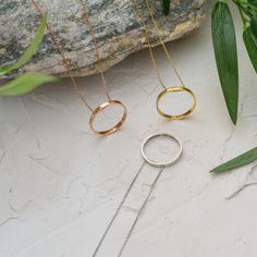 "♥ Inner Circle Necklace ♥ H O W ∙ T O ∙ O R D E R 1- Select your preferred Finish from the menu. 2- Choose your necklace length. 3- Write the custom words you want on your necklace. PRODUCT ∙ DETAILS * Ring Pendant Width is 13 mm * Outer Ring Diameter is 21mm * Ring Thickness is 100 microns * Chain sizes range from 14-22 inches * Featured Font name is Arial * Maximum Characters for Circle is 20 Letters *Necklace can be personalized with an engraving on the OUTSIDE and/or INSIDE of the circle. T Minimalist Full Circle Jewelry For Anniversary, Circular Jewelry With Adjustable Chain For Gift, Adjustable Full Circle Jewelry Gift, Halo Round Pendant Jewelry For Gift, Halo Round Pendant Jewelry Gift, Mother's Day Hoop Jewelry Gift, Simple Design Hoop Jewelry For Gifts, Minimalist Halo Jewelry For Anniversary, Rose Gold Circle Jewelry For Anniversary