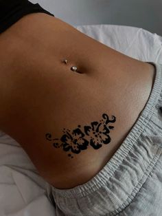 a woman with black ink on her stomach