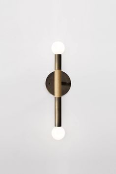 a wall light with two lights on it