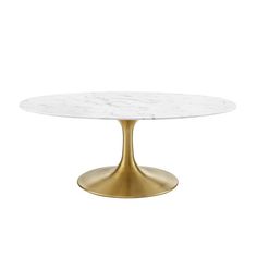 an oval white marble table with gold metal legs and a round, circular base in the middle