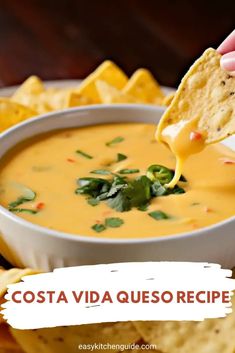 a person dipping tortilla chips into a bowl of quesadilla soup