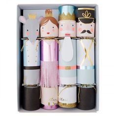 several rolls of toilet paper in a box with princess and prince decorations on them,