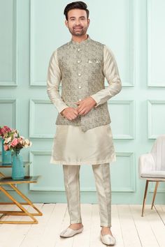 Channel your exuberance with style in our readymade off white colored art silk kurta, topped up with a grey colored woven jacquard nehru jacket.
Accompanied by an off white colored art silk pant. Colored Weave, White Kurta, Chinese Collar