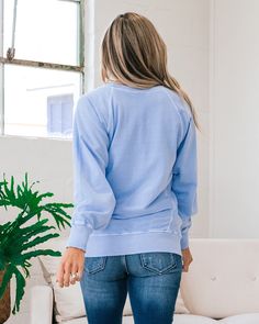 Girlfriend Crewneck Sweatshirt - Spring Blue Spring blue Crewneck Side pockets Ribbed details Good stretch Body: 100% Cotton Ribbing: 95% Cotton 5% Spandex Imported General Sizing: Small (0-4), Medium (6-8), Large (10-12), XLarge (14-16)True to sizeAdrienne is a size 4 and is wearing a Small Measurements: Small: Bust: 22" // Length: 26" Medium: Bust: 22.5" // Length: 26.5" Large: Bust: 23" // Length: 27" XLarge: Bust: 23.5" // Length: 27.5" Bust measurements are taken across the chest laying fla Blue Relaxed Fit Sweatshirt, Blue Relaxed Fit Cotton Sweater, Light Blue Long Sleeve Top With Pockets, Blue Long Sleeve Sweatshirt With Pockets, Light Blue Crew Neck Sweatshirt For Fall, Casual Blue Sweatshirt For Loungewear, Light Wash Long Sleeve Tops With Pockets, Light Blue Relaxed Fit Crew Neck Sweater, Blue Casual Sweater With Relaxed Fit