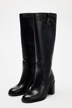 Block heel boots. Tall shaft. Buckle detail at the top of the shaft. Pointed toe. Heel height: 3 inches (7.5 cm) High Boots Low Heel, Tall Boots With Heel, High Knee Boots Outfit Winter, Going Out Boots, Lucifer Cosplay, Slim Boots, Tall Black Boots Outfit, Classy Boots