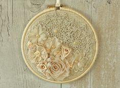 a close up of a flower on a wall hanging