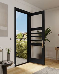 an open door leading into a living room with a potted plant in the corner