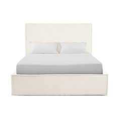 a bed with white linens and two pillows on it's headboard, in front of a white background