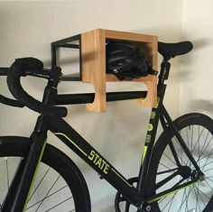 a bike is parked next to a wooden shelf