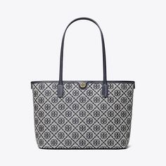 T Monogram is a classic pattern inspired by traditional Pennsylvania Dutch quilting. Meticulously crafted in woven jacquard, the collection speaks to the timelessness of great style.The small tote is trimmed in fine leather, with a zip-top closure. Lined in soft microsuede, the interior has pockets for organization. Every detail is considered, with special attention to function and versatility. T Monogram, Pennsylvania Dutch, Designer Tote Bags, Womens Designer Handbags, Designer Totes, Zip Tote, Small Tote, Classic Pattern, Tote Bag Design