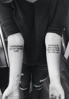 a woman with two tattoos on her arms and one has the words, i am not okay