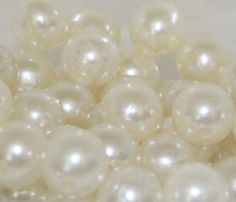 some white pearls are sitting together on a table