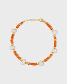 Fiery orange carnelian crystals hand strung with freshwater pearls throughout in our native New York City. This bracelet is finished with 14 karat gold. Carnelian, Pearl 14 Karat yellow gold 6 to 7 inches length 3.5mm to 7.5mm bead size Style # JJ-BAZ-125 UPC 810109745357 Orange Carnelian Gemstone Bead Bracelets, Orange Carnelian Bracelets With Natural Stones, Orange Carnelian Beaded Bracelet With Gemstone, Orange Carnelian Gemstone Beaded Bracelets, Orange Carnelian Beaded Bracelets, Orange Carnelian Gemstone Beaded Bracelet, Orange Hand-strung Carnelian Bracelets, Orange Carnelian Hand-strung Bracelets, Orange Gemstone Beaded Bracelets With Round Beads