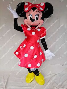 minnie mouse mascot with red and white polka dot dress