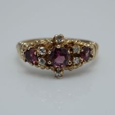 Vintage Diamond Garnet Ring  14k Yellow Gold Size 6 can be sized at a low cost  The Ring is 9.3mm across by 3.6 in Height  Diamond 0.06ct total and Garnet 0.66ct  It comes with a new gift box item # 5825 Vintage Garnet Rings, Pretty Wedding Rings, Rubellite Ring, Antique Gold Rings, Art Deco Sapphire Ring, Seed Pearl Ring, Three Necklaces, Engagement Ring Diamond Cut, Eyes Open