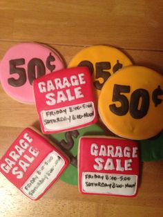 four decorated cookies with garage sale stickers on the top one is for 50 cents