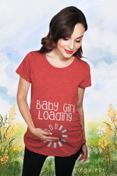 a woman wearing a red shirt with the words baby girl loaains on it