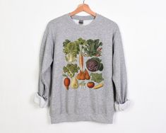 Welcome to Pink Pepper Designs Co.! All our adult and youth sweatshirts and hoodies are a super comfy style from Gildan, and are pre-shrunk blend of 50% polyester and 50% cotton. Cottagecore Vintage Vegetables Sweatshirt, Vintage Botanical Veggies Illustration, Gardening Aesthetic Sweatshirt, Light Academia Botanical Crewneck to 5XL We do not support companies that make use of child labor or sweatshops! Our amazing printing partner uses a Direct to Garment printing process using water-based biod Fall Cotton Sweatshirt With Plant Print, Fall Casual Sweatshirt With Plant Print, Cotton Sweatshirt With Plants Print For Fall, Casual Plants Print Sweatshirt For Fall, Botanical Style Cotton Sweatshirt For Fall, Veggies Illustration, Vintage Vegetables, Illustration Botanique Vintage, Gardening Aesthetic