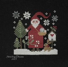 a cross stitch christmas scene with santa and his dog