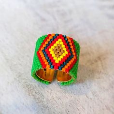 a colorful beaded bracelet with sunglasses on it