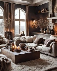 a living room filled with lots of furniture next to a fire place covered in candles