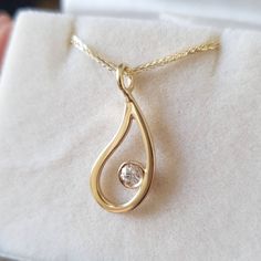 This light and delicate Paisley necklace is full off air. The clear diamond brings in just the exact sparkle. In this gold pendant your skin is the precious stone at the heart off the paisley. Hand crafted from 14k solid gold on a beautiful 14k yellow chain, set with a 10 point white diamond, very high quality polished finish. * Solid 14k gold (yellow / white / rose) * Pendant 1.8 mm tall 10 mm wide. * 1 white 3mm diamond * 18 inch / 45 cm chain * Packed in a beautiful gift box * Worldwide shipp 14k Gold Teardrop Necklace With Single Diamond, Yellow Gold Teardrop Jewelry With Bezel Setting, Drop Necklace With Single Diamond For Anniversary, Yellow Gold Diamond Teardrop Pendant Necklace, Delicate Teardrop Diamond Necklace For Anniversary, Anniversary Drop Necklace With Single Diamond, Fine Jewelry Drop Necklace With Single Diamond, Drop Necklace With Single Diamond For Gift, Gift Necklace With Single Diamond Drop Shape