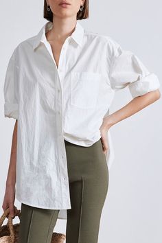 Oversized menswear-inspired shirt with classic collar, button down front, patch pockets at the chest and shirttail hem. Crafted from 100% organic cotton.