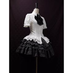 An item that will make you look like a mysterious and elegant young lady. It is richly decorated with lace embroidery and frills, and when paired with a bold chest ornament, it further enhances the gorgeous atmosphere. Like an aristocratic lady from medieval Europe. 
 
 

 

 
 
 
 Item 
 
 Blouse (black) + Jabot (black) 
 Blouse (purple) + jabot (purple) 
 Blouse (white) + Jabot (white) 
 Blouse (white) + Jabot (black) 
 Brooch (black x blue) 
 Brooch ( Black x Red) 
 Brooch ( Black x Purple) Elegant Fitted Ruffle Blouse, Elegant Fitted Baroque Dress, Fitted Victorian Dress With Ruffles And Overbust, Fitted Victorian Overbust Dress With Ruffles, Black Gothic Blouse For Formal Occasions, Fitted Victorian Dress With Ruffles In Baroque Style, Elegant Dresses With Ruffles And Overbust Shape, Black Fitted Victorian Dress For Wedding, Black Fitted Blouse With Ruffled Collar