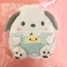 a stuffed animal with a rubber ducky in it's mouth on a plastic bag