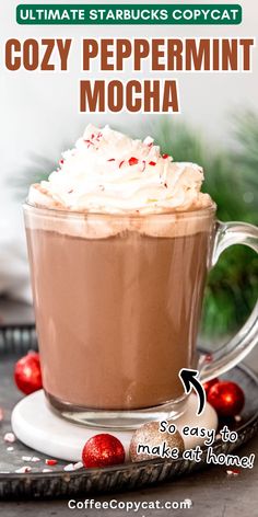 a cup of coffee with whipped cream on top and the words cozy peppermint mocha above it