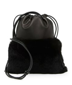 NEW Alexander Wang Ryan Mini Rabbit Fur Leather Shoulder Bag Color: Black Leather Size: 9.75" Hx 7.25" W x 0.5" D Condition: new with tags and box. Retail price: $695+tax A simple and sleek design that features genuine rabbit fur and a smooth leather construction. - Shoulder strap - Drawstring closure - Exterior features a leather construction, genuine rabbit fur, and topstitched detail - Approx. 9.75" x 7.25" W x 0.5" D - Approx. 17" handle drop - Imported Materials Leather exterior, genuine ra Mini Rabbit, Alexander Wang Bag, Studded Bag, Fur Bag, Crossbody Clutch, Leather Hobo Bag, Studded Leather, Leather Zipper, Rabbit Fur