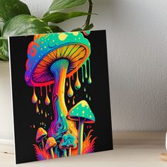 a colorful mushroom with drops of paint on it art board print