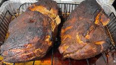 two cooked meats sitting on top of a grill