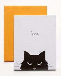 a greeting card with a black cat's face and the words boo on it