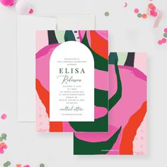 the wedding stationery is shown with confetti scattered around it, including pink and green