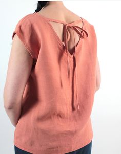 "Handmade natural washed linen loose top. Made with love for You. *100% local medium weight linen *Each item is individually cut and sewn by order *The model is wearing size S, blouse color - Apricot *Note that colors may look different on your display depending on their settings and technical characteristics. Please let us know if you need different measurements or colors. CARE *Machine wash up to 40 / 104F gentle cycle *Iron inside out at medium high *Do not bleach *Do not tumble dry MAKING TI Beach-ready Short Sleeve Tops With Tie Back, Beach Short Sleeve Tops With Tie Back, Beach Tops With Tie Back And Short Sleeves, Beach Tie Back Short Sleeve Tops, Casual Linen Tie-back Tops, Casual Short Sleeve Tops With Tie Back, Bohemian Linen Short Sleeve Blouse, Bohemian Short-sleeve Linen Blouse, Bohemian Short Sleeve Linen Blouse