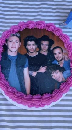 a cake with the image of one direction on it