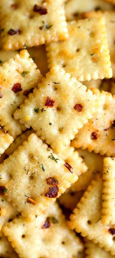 cheesy crackers with pepperoni and parmesan cheese on top are ready to be eaten