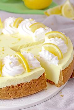 a cheesecake with lemons and whipped cream on top