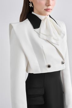 Expertly crafted with a structured double-breasted design, this jacket exudes sophistication and style. Perfect for any occasion, this jacket offers a flattering silhouette and timeless elegance. Made with precision and attention to detail, it is a must-have addition to any wardrobe. Short Jacket For Women, Elegant Outerwear With Suit Collar For Semi-formal Occasions, Chic Evening Blazer With Lapel Collar, Luxury Double-breasted Evening Outerwear, Luxury Double-breasted Outerwear For Evening, White Double-breasted Tuxedo Outerwear, Formal Double-breasted Cropped Jacket With Buttons, Designer Double-breasted Formal Outerwear, White Tuxedo Style Evening Outerwear