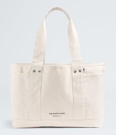 Hyper-functional and handy, the Circular Cotton Tote is made with 100% recycled, durable cotton canvas so you can carry everything you need, day after day. It features a laptop sleeve and thoughtful organizer pockets so your essentials don’t get lost. And as a Circular Design style, you can recycle it with us at the end of its time with you. Bags & Gear Messengers & Totes [North Face, Northface, thenorthface, the northface, TNF, tnf] The North Face Practical Bags For Everyday Use, Practical The North Face Bags For Everyday Use, Casual The North Face Bags With Functional Pockets, Functional Cotton Canvas Travel Bag, Casual Canvas Bag With Functional Pockets For Everyday, Practical Everyday Bags By The North Face, Everyday Cotton Bags With Functional Pockets, Functional Everyday Cotton Canvas Bag, Functional Cotton Canvas Bag For Everyday Use