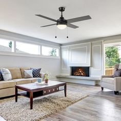 a living room filled with furniture and a fire place